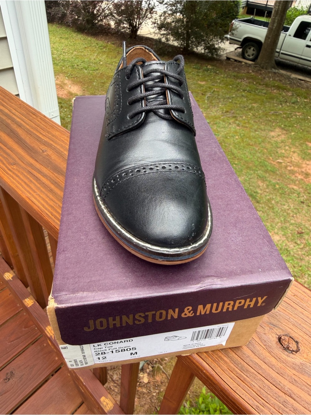 Johnston & Murphy Black Cap-Toe Derby with Brogue Detailing